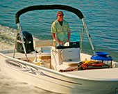 Man in Surf City on Topsail Boat Rental 17 Foot Center Console Triumph Skiff Image